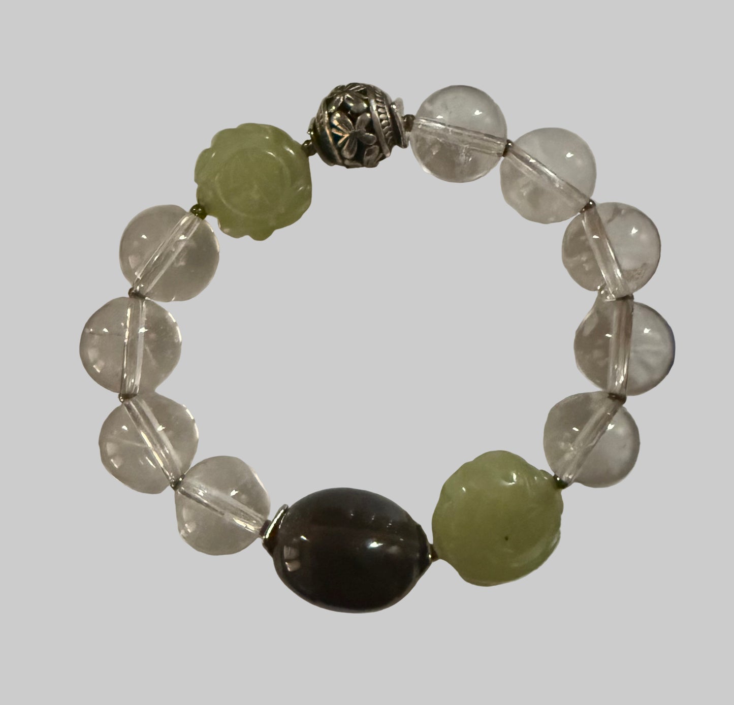 Clear Quartz Bracelet with Smoky Quartz and Carved Jade Accent Beads